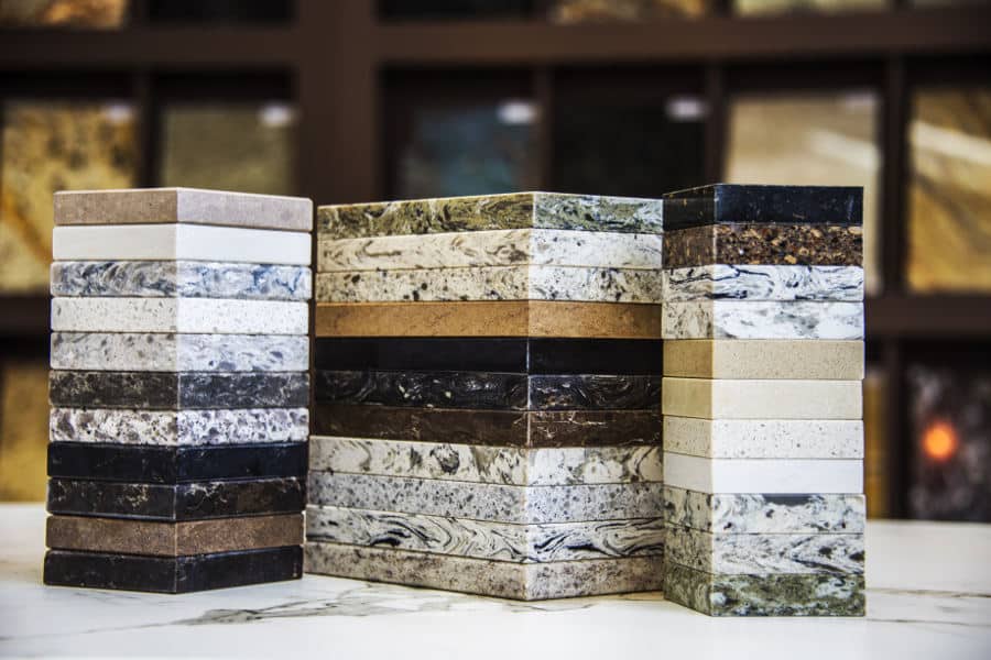 Sound-reflecting materials like granite and marble.
