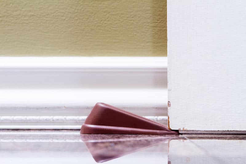Stick a door stopper under your door and prevent it from slamming shut.